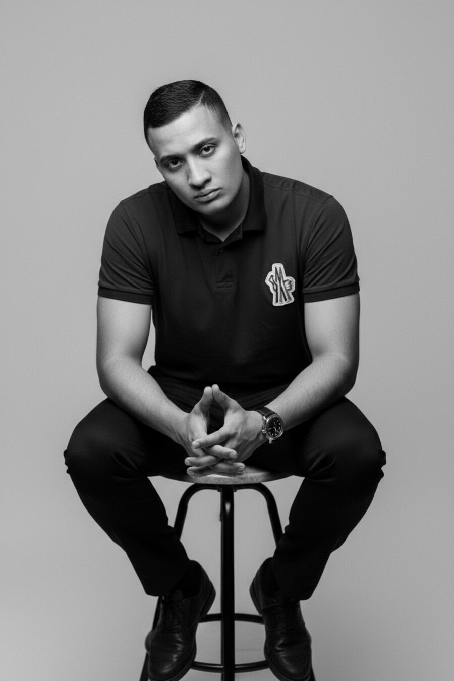 Olvin George seated, studio portrait